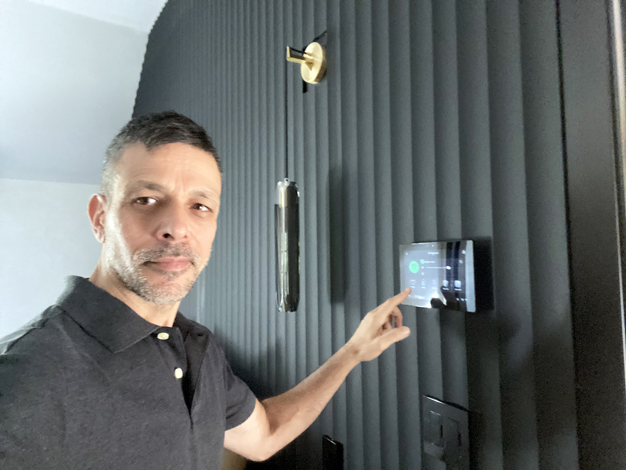 Leo Bitton beside a completed Control4 touch screen installation in West Hollywood