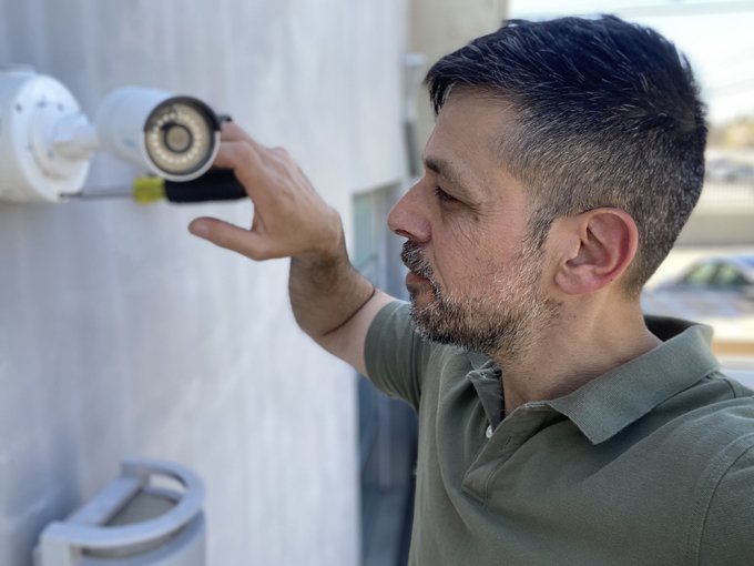 Leo installing a residential security camera system